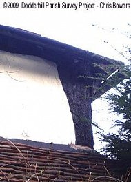 Upturned tree trunk used as a corner post